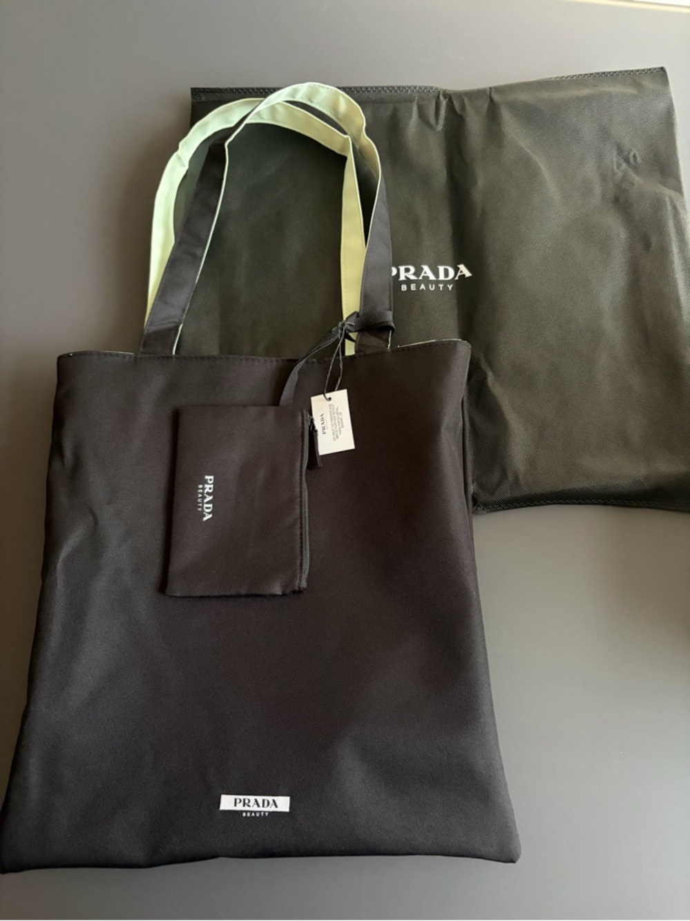 Reversible Prada Black Tote Bag with Mint Handles from beauty event